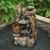 LuxenHome Resin Stacked Rock Wall And Barrel Outdoor Fountain With Lights Brown